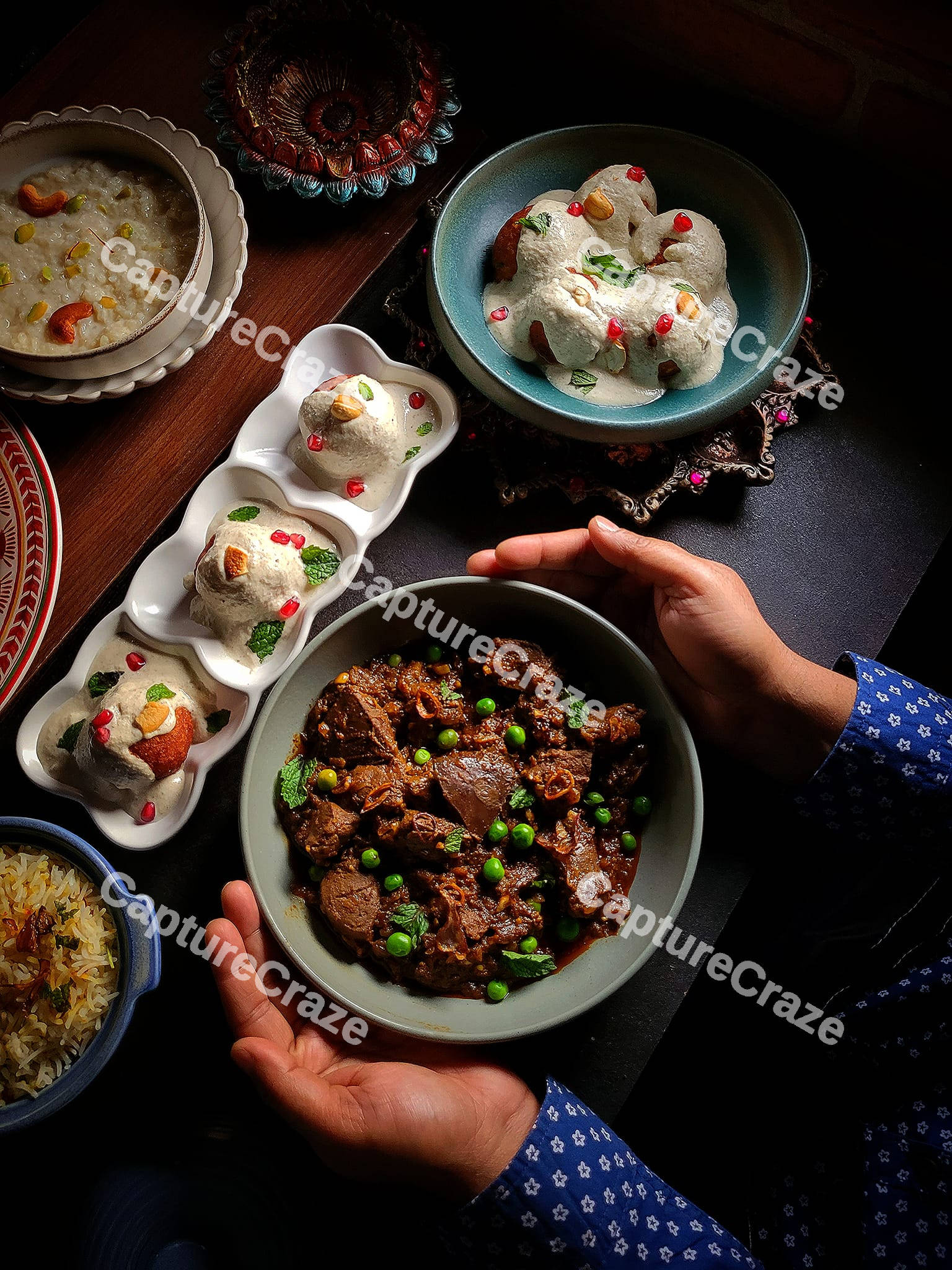 A person holding a bowl with beef stew